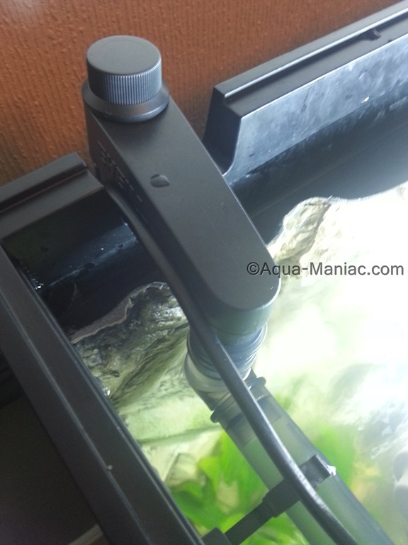 aquarium filter pipe outlet installed behind the 3d background